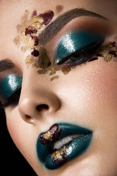Young woman with fantasy bright make up. - Foto, imagen