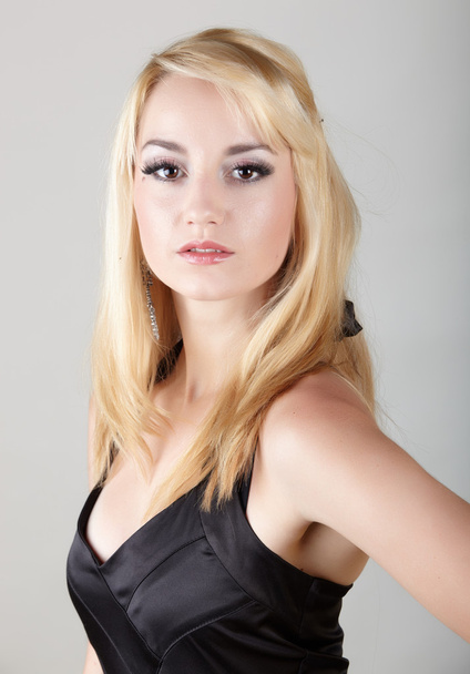 Young adult caucasian woman with blonde hair and prominent jewelry - Fotoğraf, Görsel