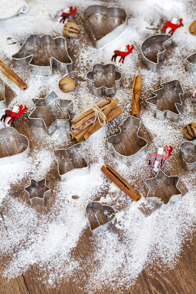 Christmas food background with cookies molds and flour - Fotografie, Obrázek