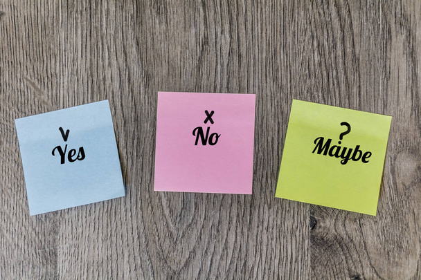 Colorful Sticky Notes with Yes,No and Maybe Text on a  Wooden Background - Foto, Imagen