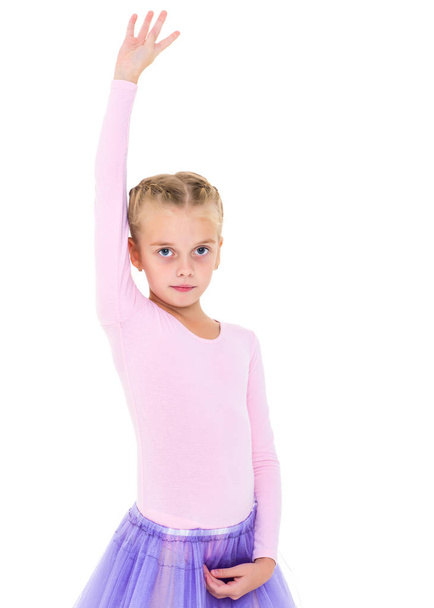 Little girl ballerina performs dance. - Fotoğraf, Görsel
