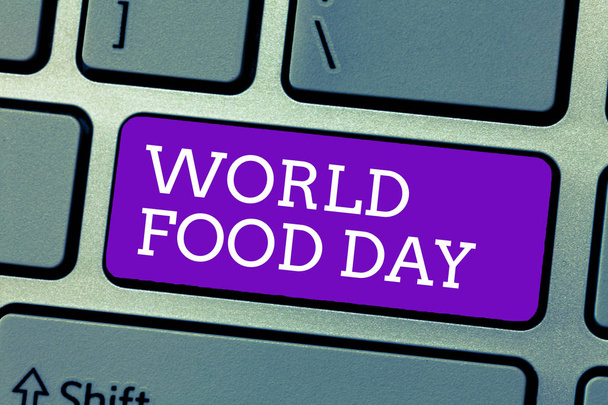 Parola che scrive testo Giornata Mondiale dell'Alimentazione. Concetto imprenditoriale per la Giornata mondiale dell'azione dedicata alla lotta contro la fame nel mondo
 - Foto, immagini