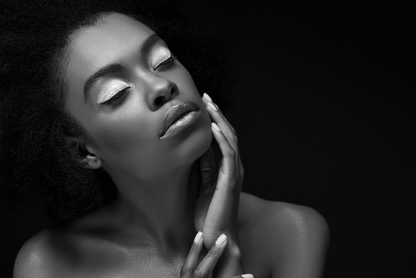 black and white photo of attractive african american woman isolated on black - Фото, изображение