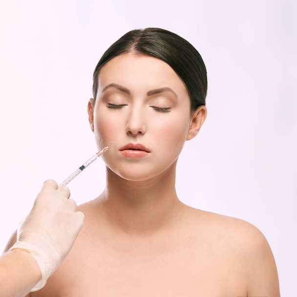 woman face injection. salon cosmetology procedure. skin medical care.  dermatology treatment. anti aging wrinkle lifting. - Photo, Image