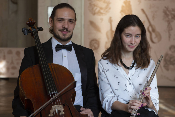 Duo of Classical Musicians Cello and Flute Genre portrait - Foto, imagen