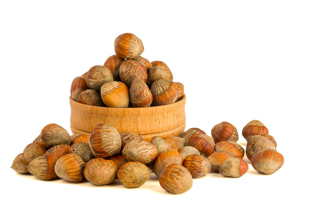 Walnut hazelnut isolate on a white background. Nuts hazel of a Turkish wooden bowl. The concept of a healthy dietary diet packed with vitamins vegetarianism veganism - Photo, Image