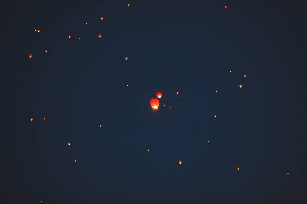 Flying chinese lanterns in dark sky - Photo, image