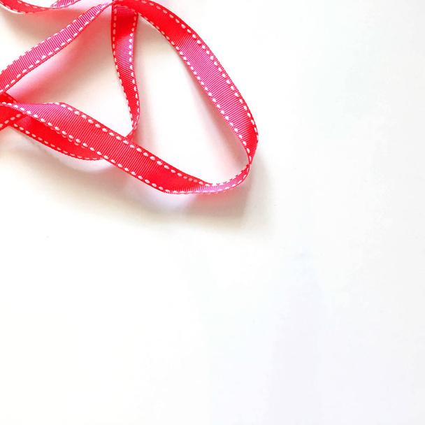 Red ribbon on white background - Fotoğraf, Görsel