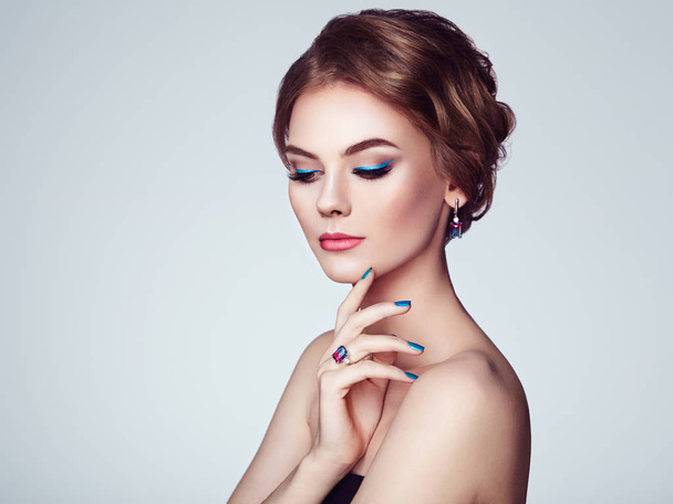 Portrait Beautiful Woman with Jewelry. Model Girl with Blue Manicure on Nails. Elegant Hairstyle. Blue Make-up Arrows. Beauty and Accessories - Photo, Image