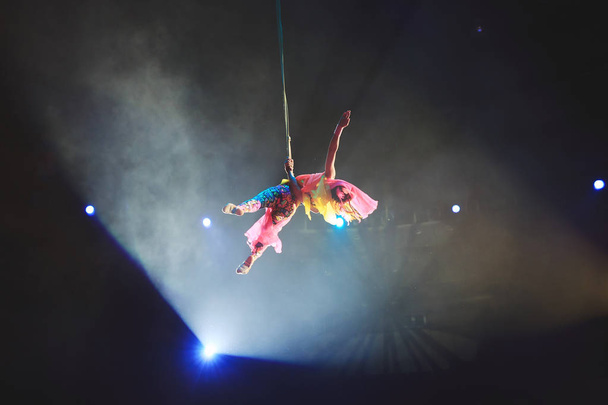 Performance of the girl aerial acrobat in the circus. - Φωτογραφία, εικόνα