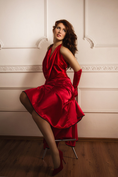 Fashionable lady in a red dress - Фото, изображение