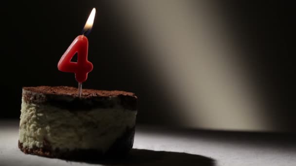 Candle four in tiramisu cake. Birthday vintage background - Footage, Video
