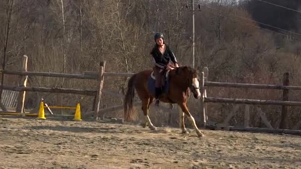 Teenager girl learns riding lessons in the mountain environment - Footage, Video
