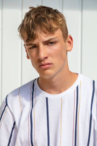 Young adult male boy teenager blond outside in summer sunshine  - Φωτογραφία, εικόνα