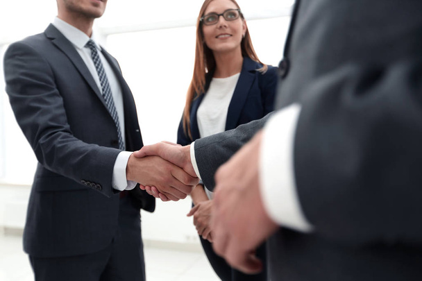 Business shaking hands in the office - Photo, image