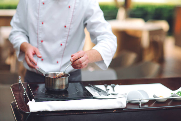 male chef preparing the Foie gras for guests in restaurant - Foto, immagini