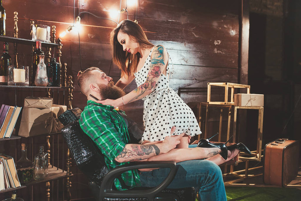 Barber girl shaves the bearded man. - Photo, Image