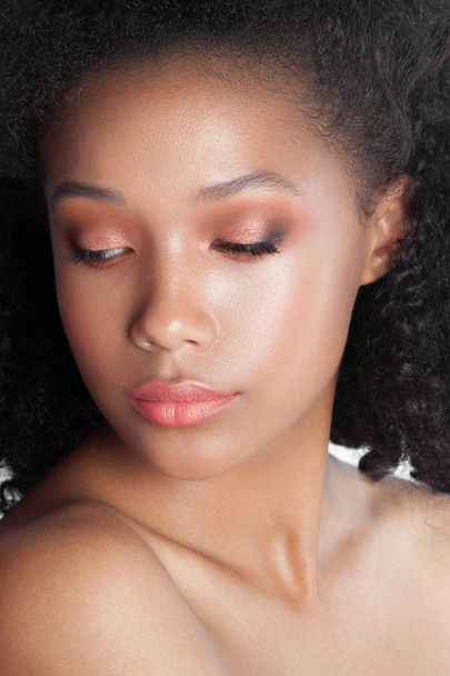 Young beautiful black girl with clean perfect skin close-up. Beauty portrait - Zdjęcie, obraz