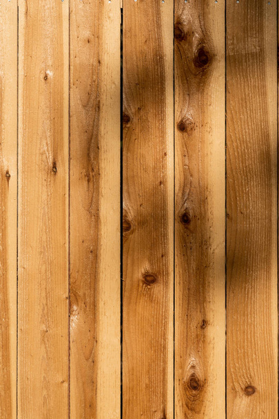 Vertical weathered brown wood background surface. Wooden wall te - Photo, Image