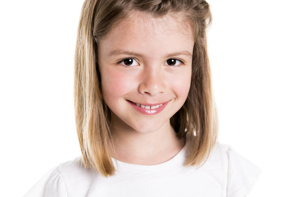 Portrait of a cute 7 years old girl Isolated over white background - Valokuva, kuva