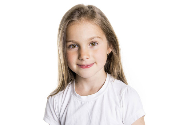 Portrait of a cute 7 years old girl Isolated over white background - Valokuva, kuva