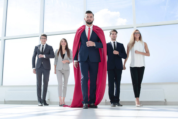 businessman-superhero and business team standing in the office.photo with copy space - Foto, immagini