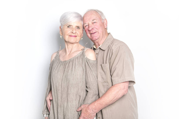 Senior couple posing on studio white background - Photo, Image