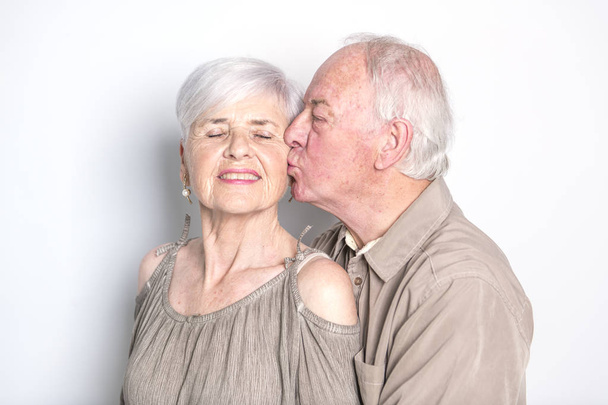 Senior couple posing on studio white background - Valokuva, kuva