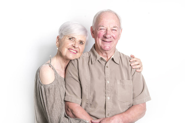 Senior couple posing on studio white background - Фото, зображення