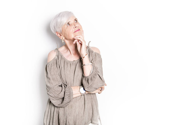 elderly woman on studio white background - Foto, Bild