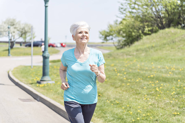 Senior Woman Jogging In Park - Photo, image