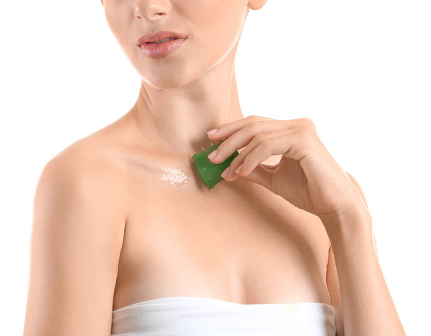 Beautiful young woman with aloe vera on white background - Photo, Image