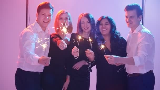 Group of friends having fun with sparklers. Night Party concept - Footage, Video