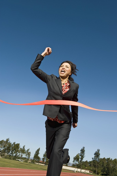 Businesswoman Crossing The Finish Line - Foto, afbeelding