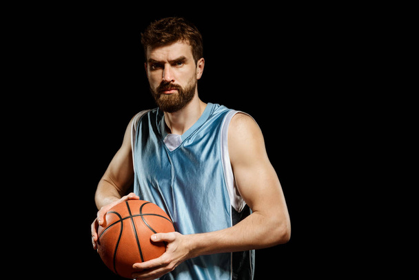 Muscular man playing basketball - Fotó, kép