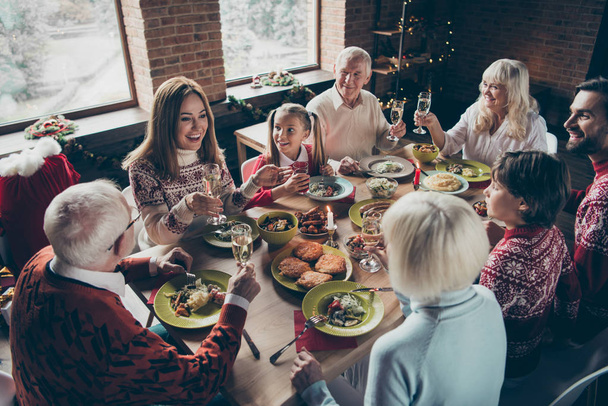High above angle view of noel diverse family gathering. Cheerful - Фото, зображення
