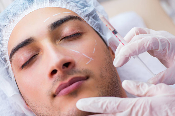 Man visiting doctor for plastic surgery  - Photo, Image