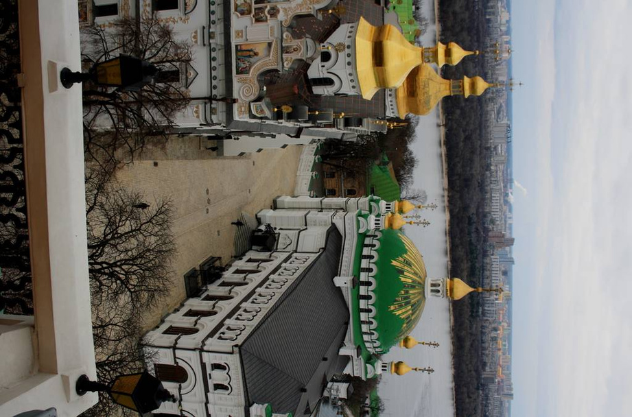 Kiev Pechersk Lavra on hill of Dnieper river with city on background  - Photo, Image