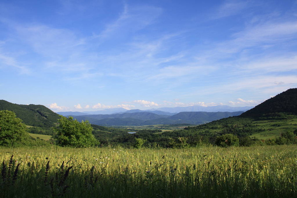picturesque view of meadow and mountains with sky background  - Photo, Image