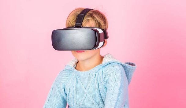 Virtual reality future technology. Discover virtual reality. Kid boy wear vr glasses pink background. Child boy play virtual reality game. Explore alternative reality. Cyber space and virtual gaming - Foto, Imagen
