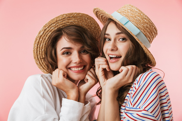 Image of funny cute young women friends posing isolated over pink background. - Φωτογραφία, εικόνα
