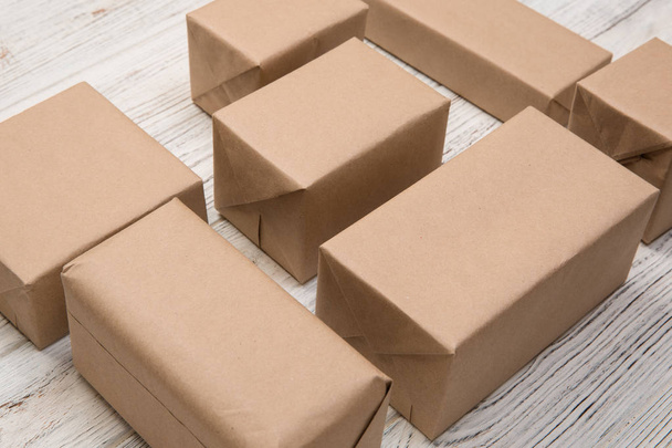 a lot of cardboard box on white wooden background. top view. - Photo, Image