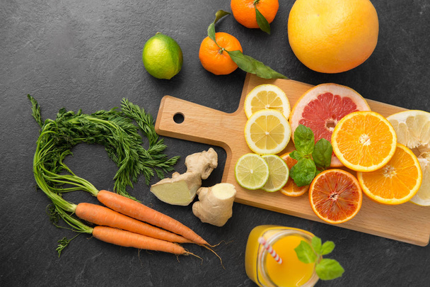 fruits, vegetables, cutting board and juice - Zdjęcie, obraz