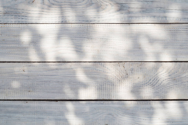 Surface of white planks with rays of light - Fotoğraf, Görsel