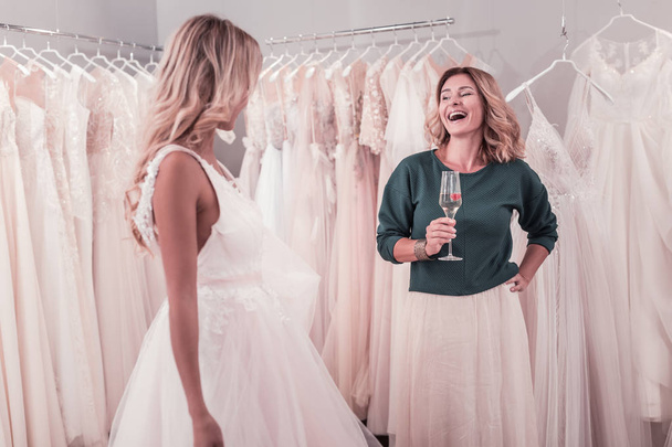 Positive delighted woman laughing in the wedding shop - Foto, Imagem