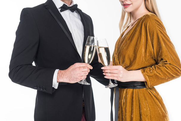 partial view of fashionable couple clinking glasses of champagne isolated on white - Fotografie, Obrázek