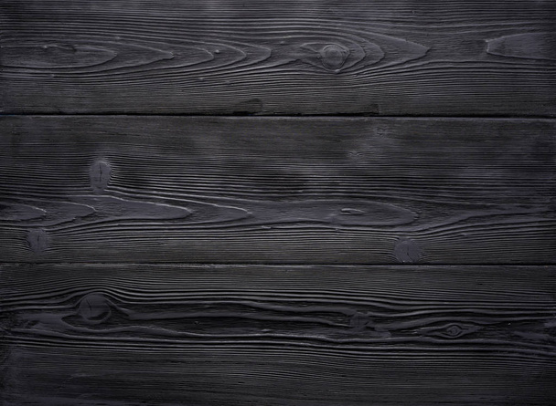 Background of old vintage black wooden boards. Strongly worn and scratched. - Фото, изображение