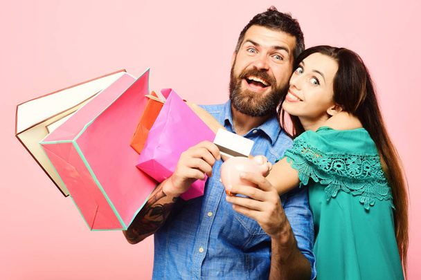 Guy with beard and lady with happy faces do shopping - Photo, Image