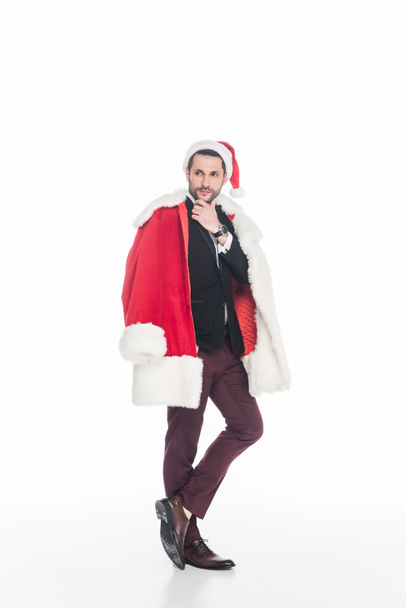 pensive man in santa claus costume looking away isolated on white - Zdjęcie, obraz
