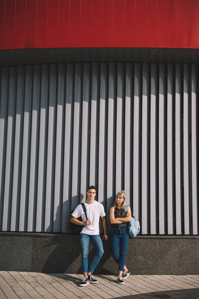 stylish young couple standing together on urban street  - Zdjęcie, obraz